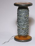 Wood bobbin, spun printed handmade paper